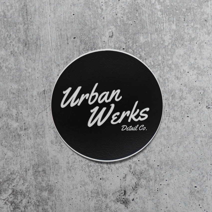 Logo Sticker read Urban Werks Detail Co. in Cursive White Text on a black background. Circle sticker