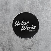 Logo Sticker read Urban Werks Detail Co. in Cursive White Text on a black background. Circle sticker
